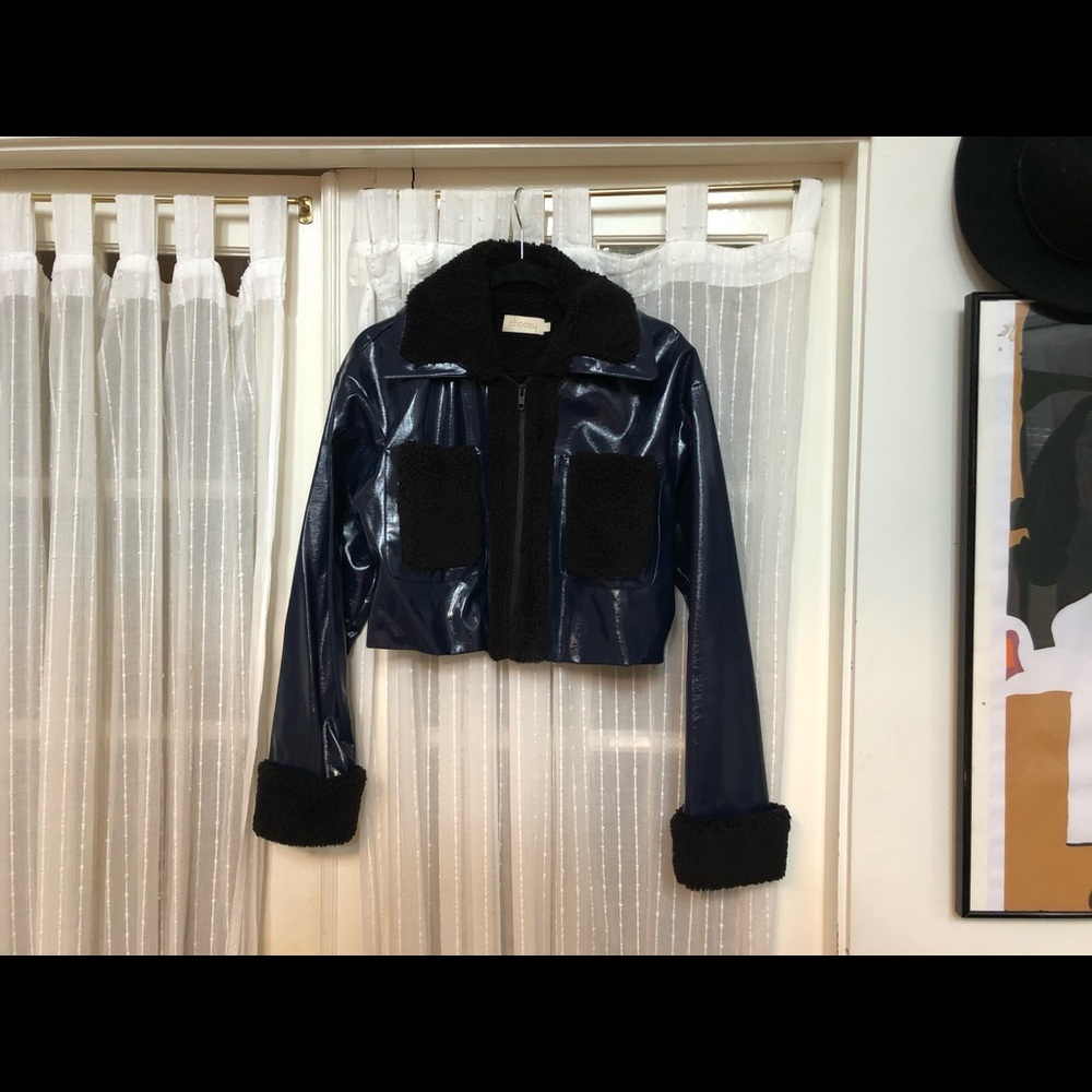 Cropped patent leather/shearling jacket